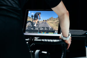 Screen view of Wahoo SYSTM workout from behind cycling as riding indoor bike