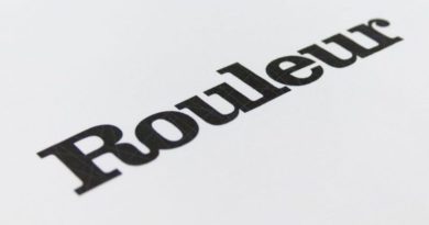 Rouleur logo at a 45 degree angle printed on white paper