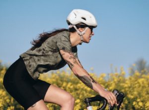 Close frame side shot of woman riding gravel bike 