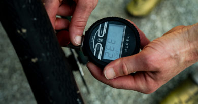 Silca Truth Pressure Gauge in use, being held in 2 hands as reading is checked