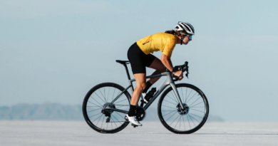 Woman riding Enve Melee from right to left across salt flats