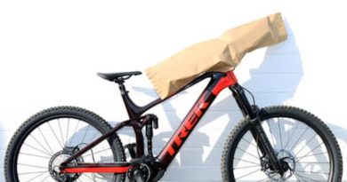 Trek mtb with bars rotated 90 degrees for transit, with Mondi Protector Bags covering the bars