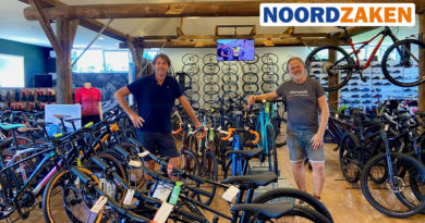 Bert and Luke Belga stood with a range of bikes in their now Broekhaus auto owned cycle store