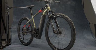 Cannondale Trail Neo 1 in studio with grey back drop, bike at a 45 degree angle, drive side on