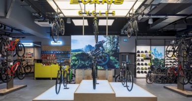 New Evans Cycles store with bikes on plinth under signage