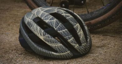 Limited edition BBB artwork helmet on floor by gravel bike wheel