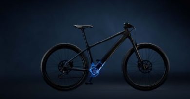 Dark background with silouhette of bike showing electric blue highlight for motor an battery