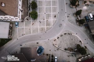Urban cyclist shot from overhead drone