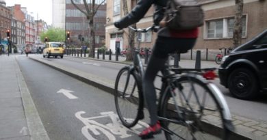 Commuter riding in segregated cycle lane