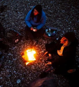 Group gathered around campfire