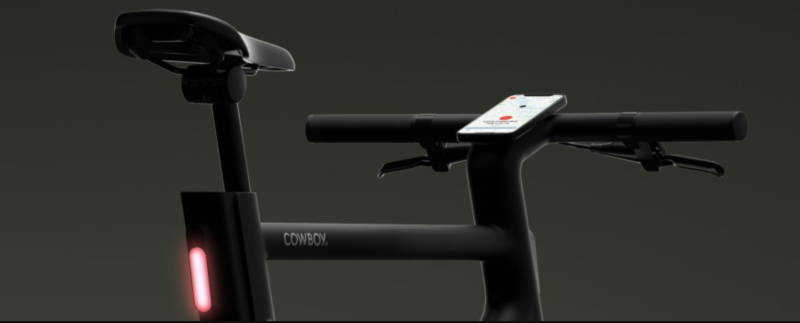 Close crop of Cowboy eBike with rear light on and smartphone mounted on stem
