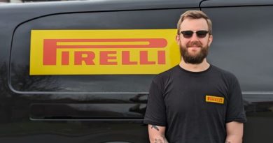 Sam Moye stood by van with Pirelli logo on its side