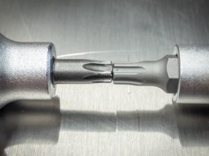 Screwdriver socket 1/2" with TX Plus profile side by side with conventional Torx head 