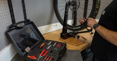 Unior Master wheel building kit and wheel truing stand in use on workstation