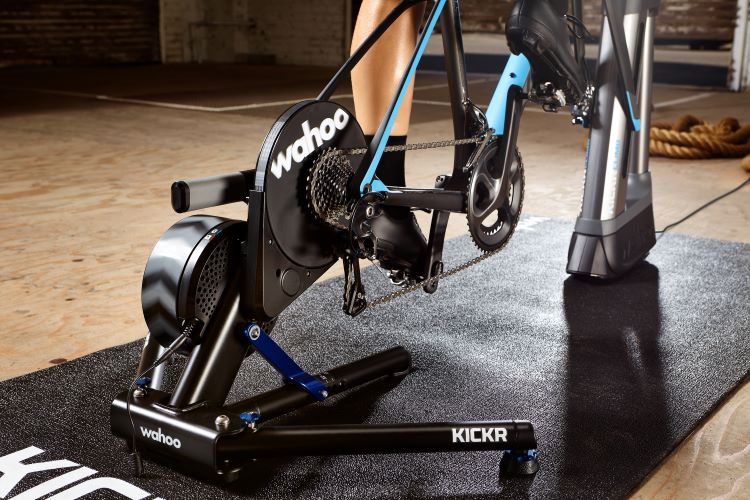 Close crop of Wahoo Kickr and ClimbPro on Wahoo turbo trainer mat