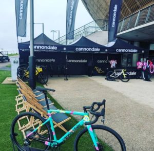 Cannondale branded marquees with deck chairs, and EF team bike on display in background and gravel bike in foreground 