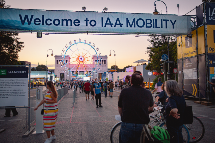 IAA Mobility Open Space image with banner overhead and fairground wheel in background