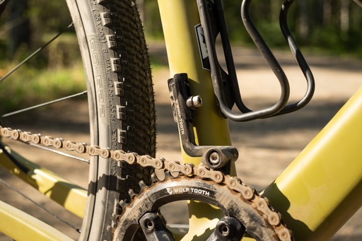 Close up of dusty Gravel bike crank, with Wolf Tooth Chainguide fitted