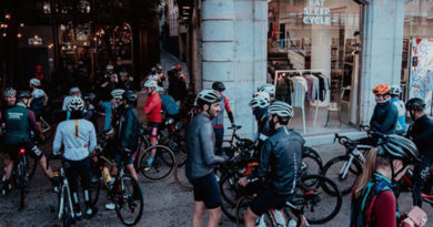 Eat Sleep Cycle Girona Hub with a crowd of cyclists ready to ride