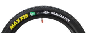 Side on close up of top third of Maxxis Seawastex tyre, with logos on show