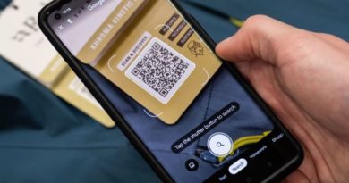 Mobile phone shown scanning QR code on Rab clothing label