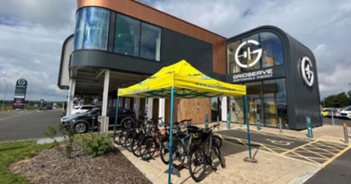 GRIDESERVE Norwich Electric Forecourt with Smilebikes gazebo set up and Raleigh eBikes on display