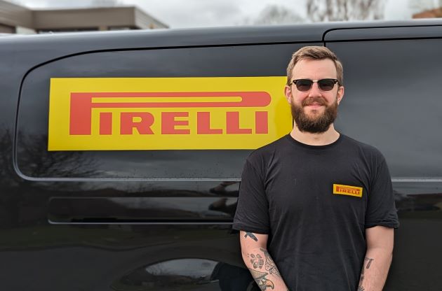 Sam Moye, dedicated Pirelli Retail Specialist for Extra UK, stood by Pirelli branded van