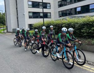 Riders of the Men's and Women's Afghan cycle team in 2 lines, ready to set off on training ride 