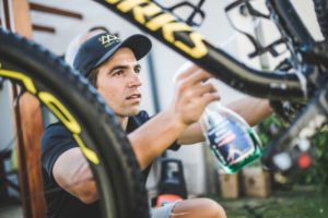 Man using Squirt cleaner to wash his mountain bike