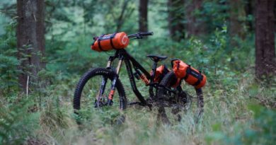 Full suspension mountain bike kitted out with aeroe mounts and bags, front and back