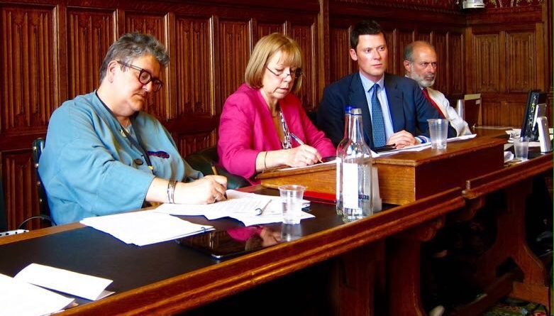 All-party panel on the APPGCW Road Justice inquiry - 1 woman and 3 men sat at a desk
