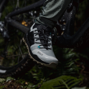 Fizik Ergolace GTX right shoe on rider with foot on pedal. Close crop out on trail.