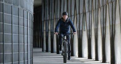 Dr Jan Bekker, Porsche eBike Performance CEO riding a bike in an urban setting