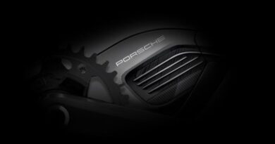 Porsche branded eBike motor in close up shot with dark lighting shading the background
