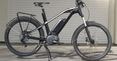 eBike on kick stand parked in front of garage door